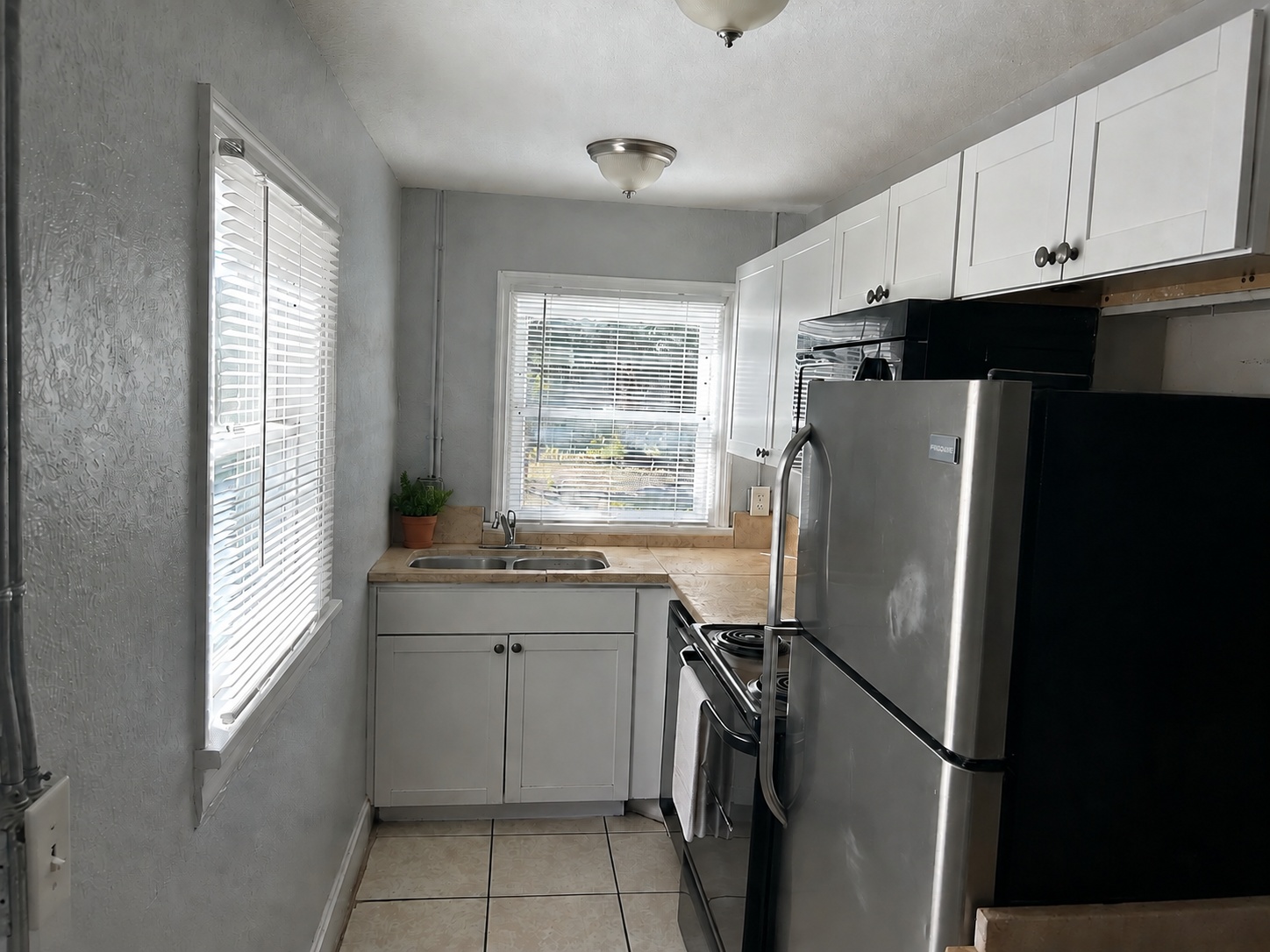 Galley kitchen, virtually staged